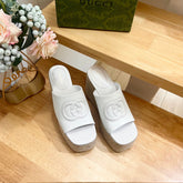 HIGH 10CM WEDGE SANDALS IN WHITE SHEEPSKIN